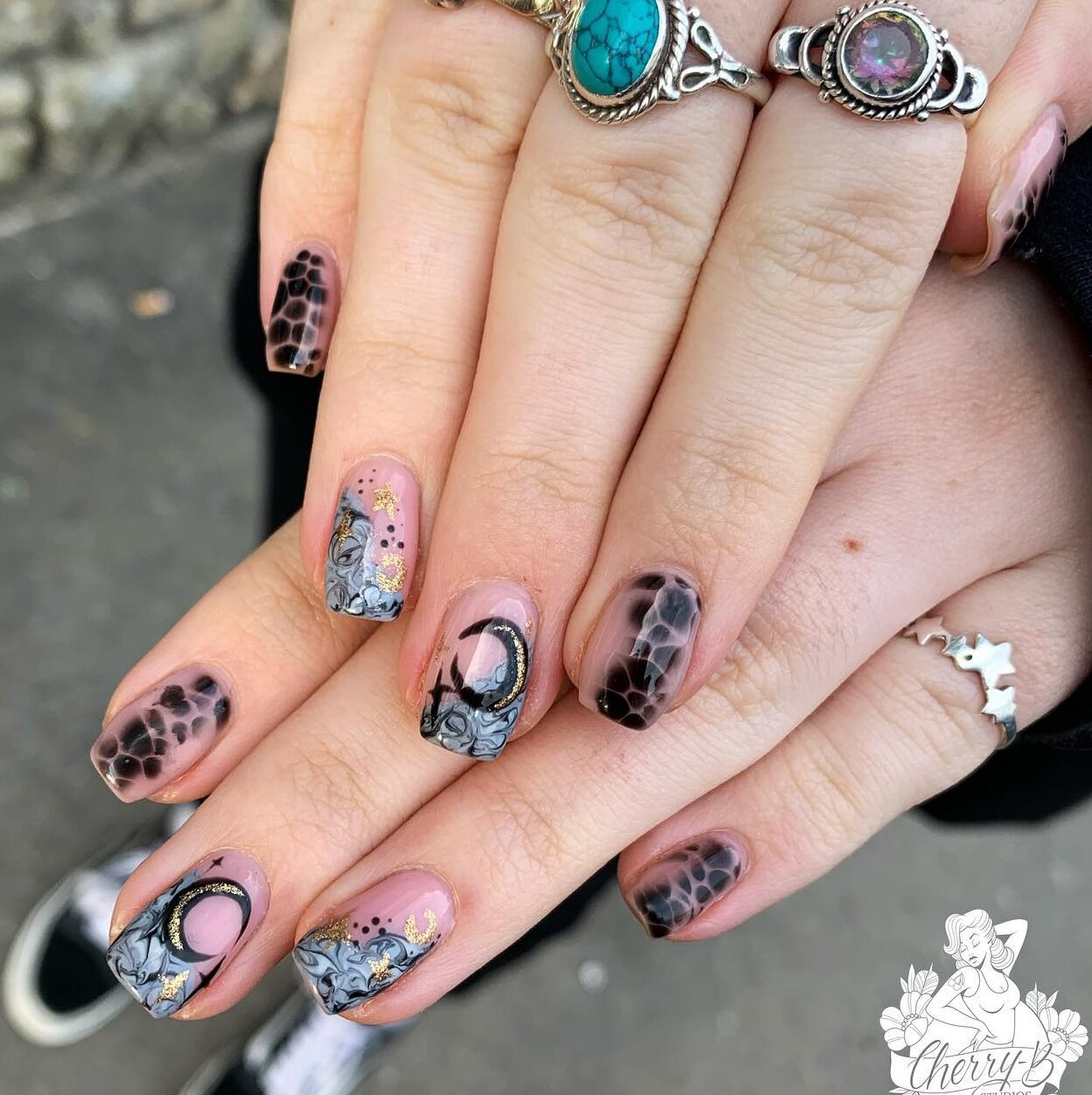 Black abstract and goth style nail arts on short square nails