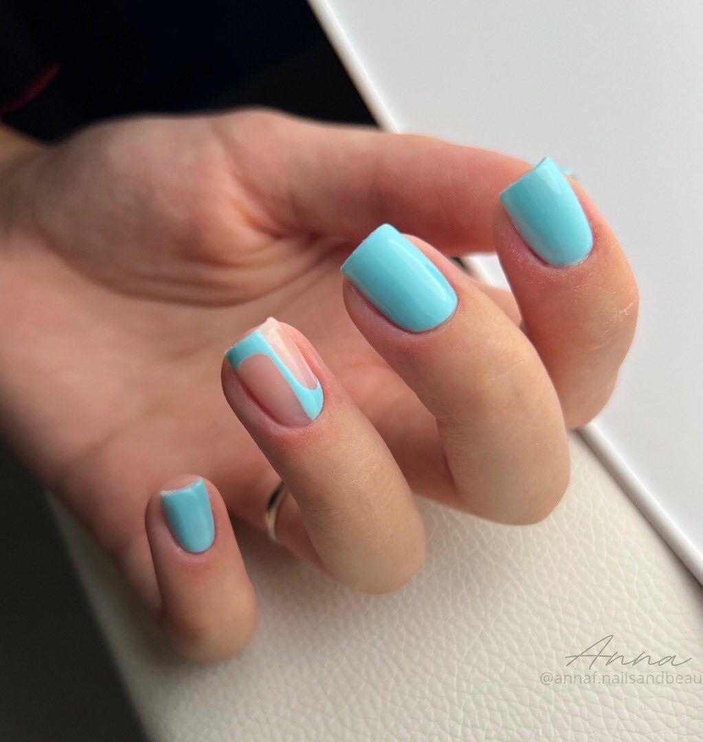 Baby blue nail color and abstract nail art on short square nails