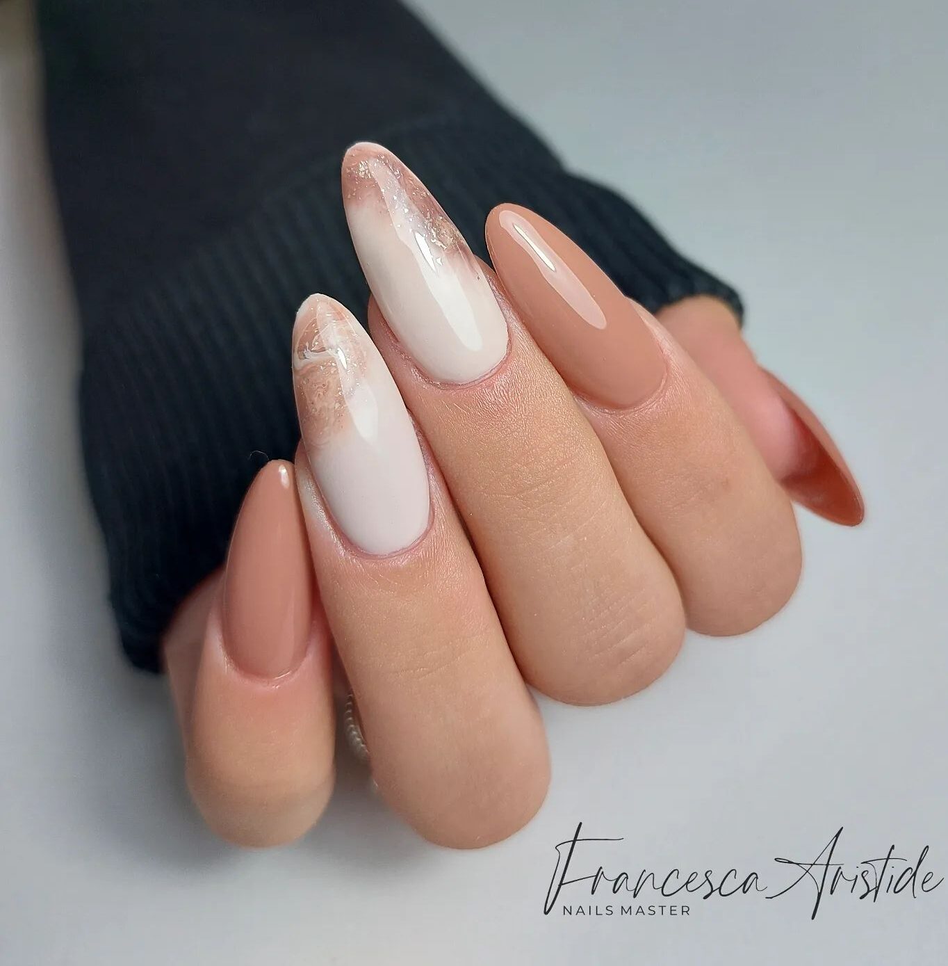 Nude brown and beige nail colors with nude brown marble nail art on long almond acrylic nails