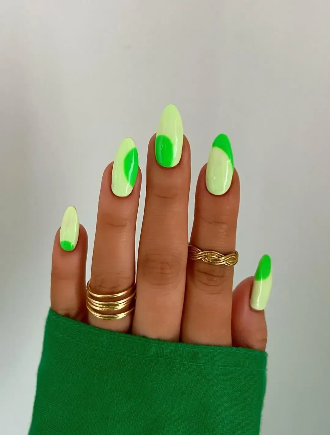 Neon green nails with pastel green.