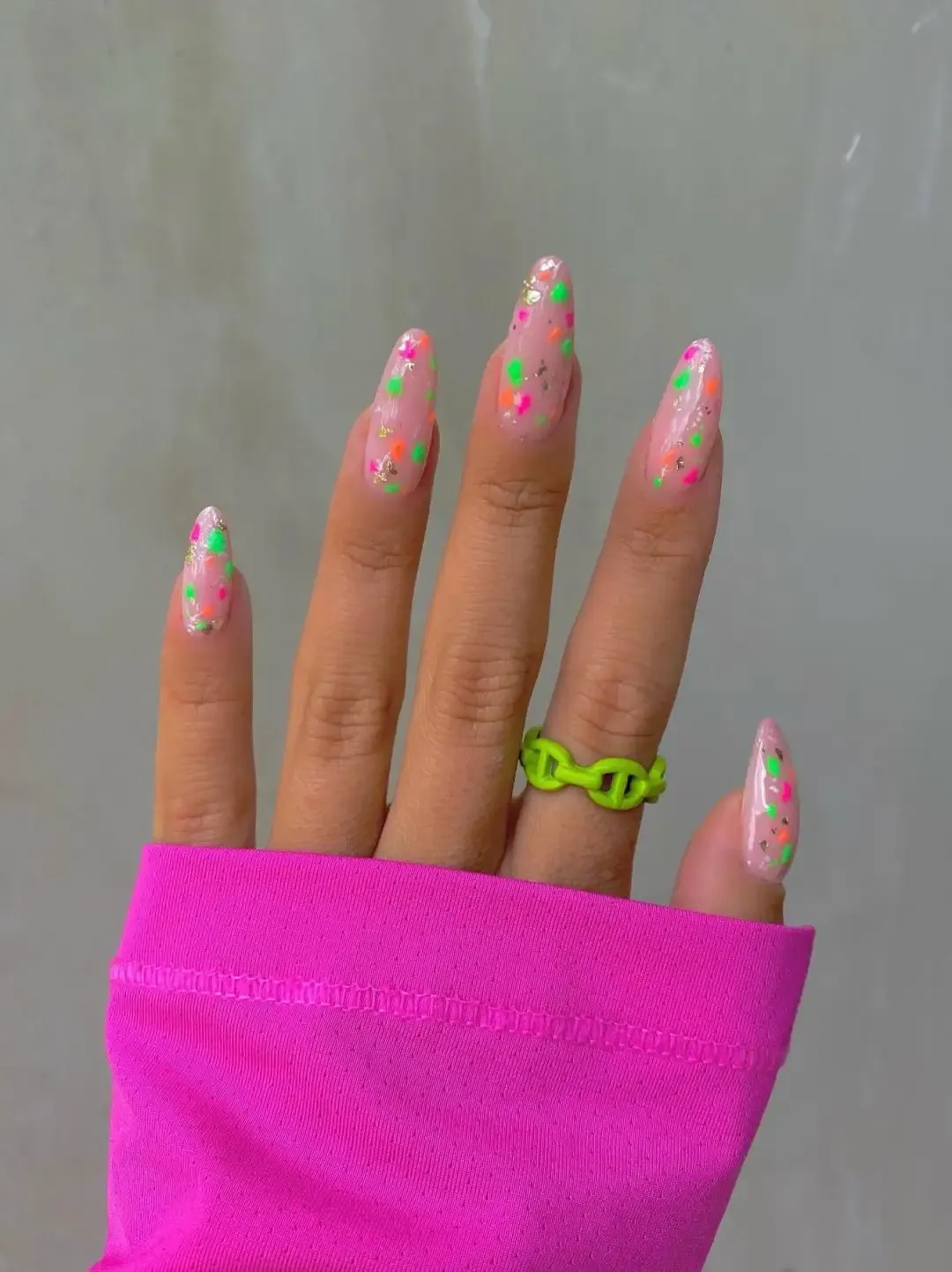 Neon speckled nails.