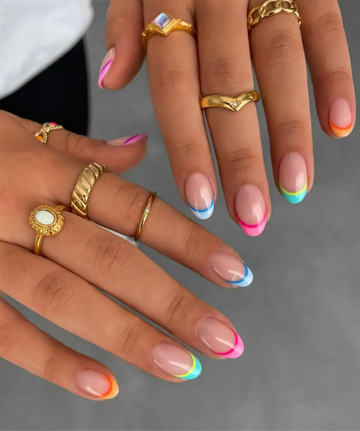 Short neon French tip nails in almond shape.