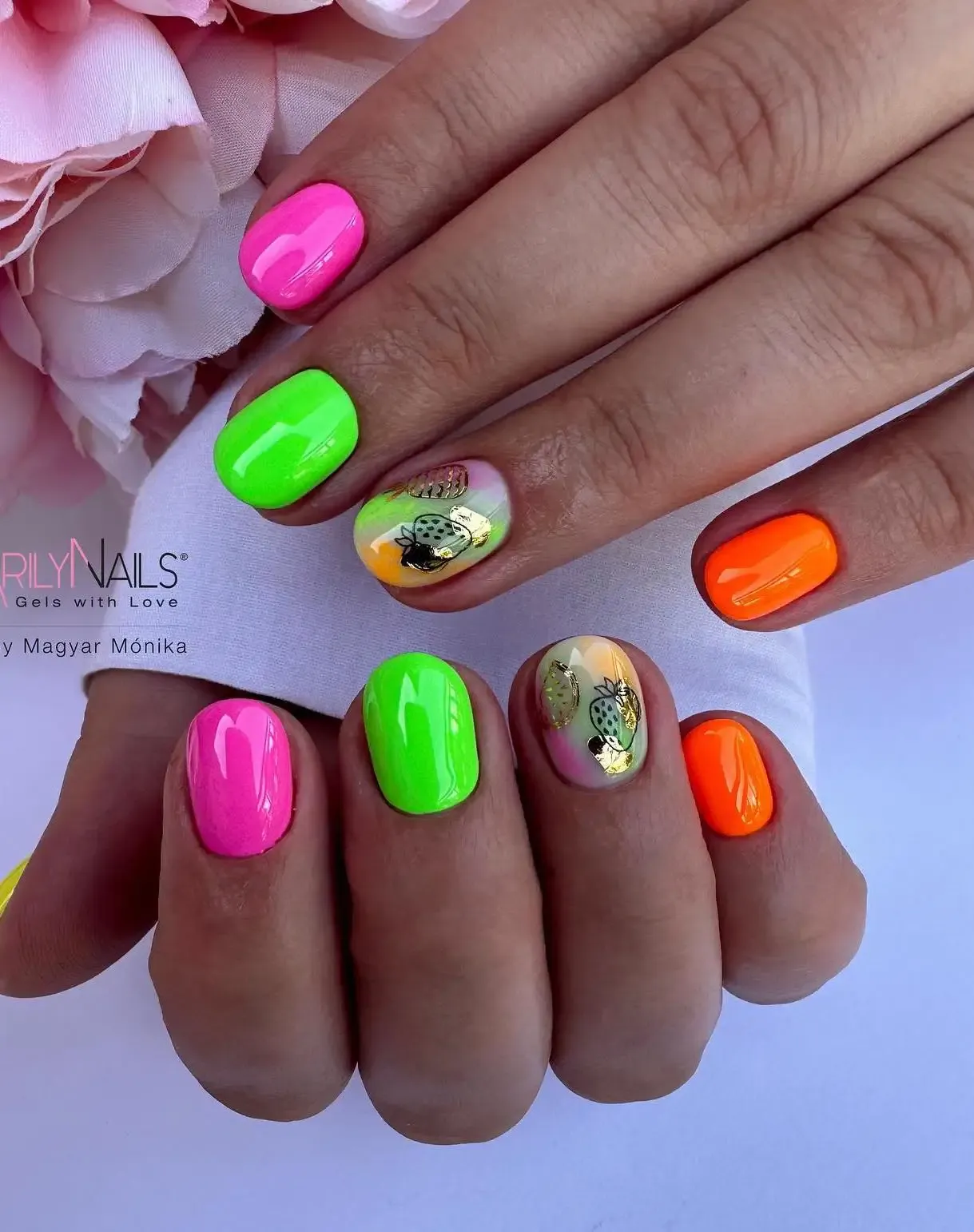 Short neon nails with green, pink and orange.