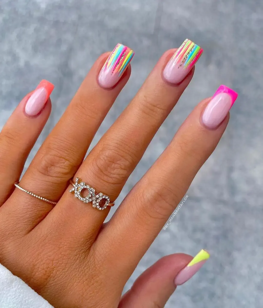 Bright neon nails with stripes.