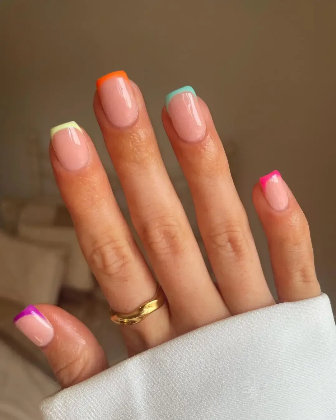 Neon French tip nails.