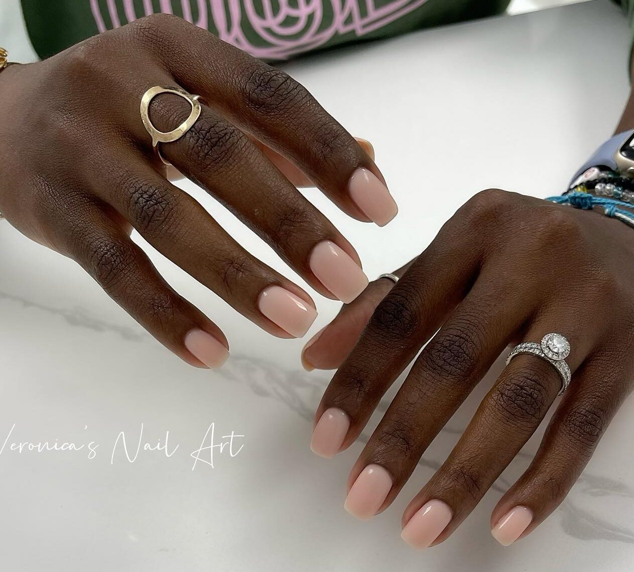 Plain nude nail polish on short square nails