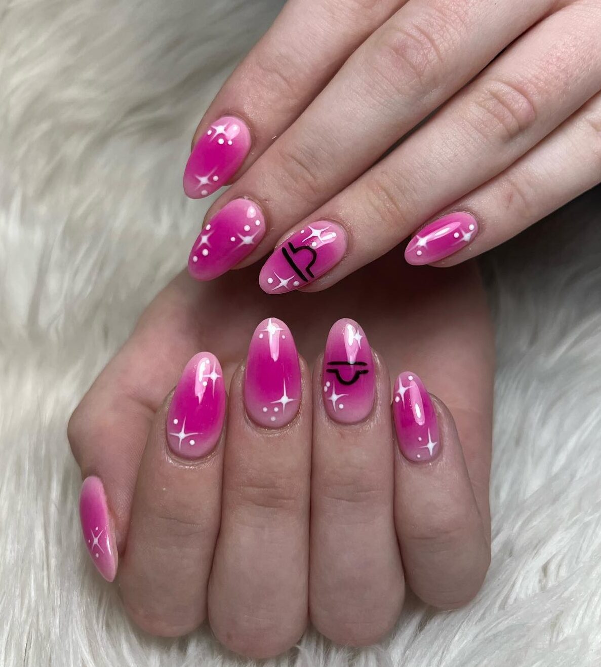 Pink aura gradient nail design with Libra sign and celestial nail arts on medium round nails