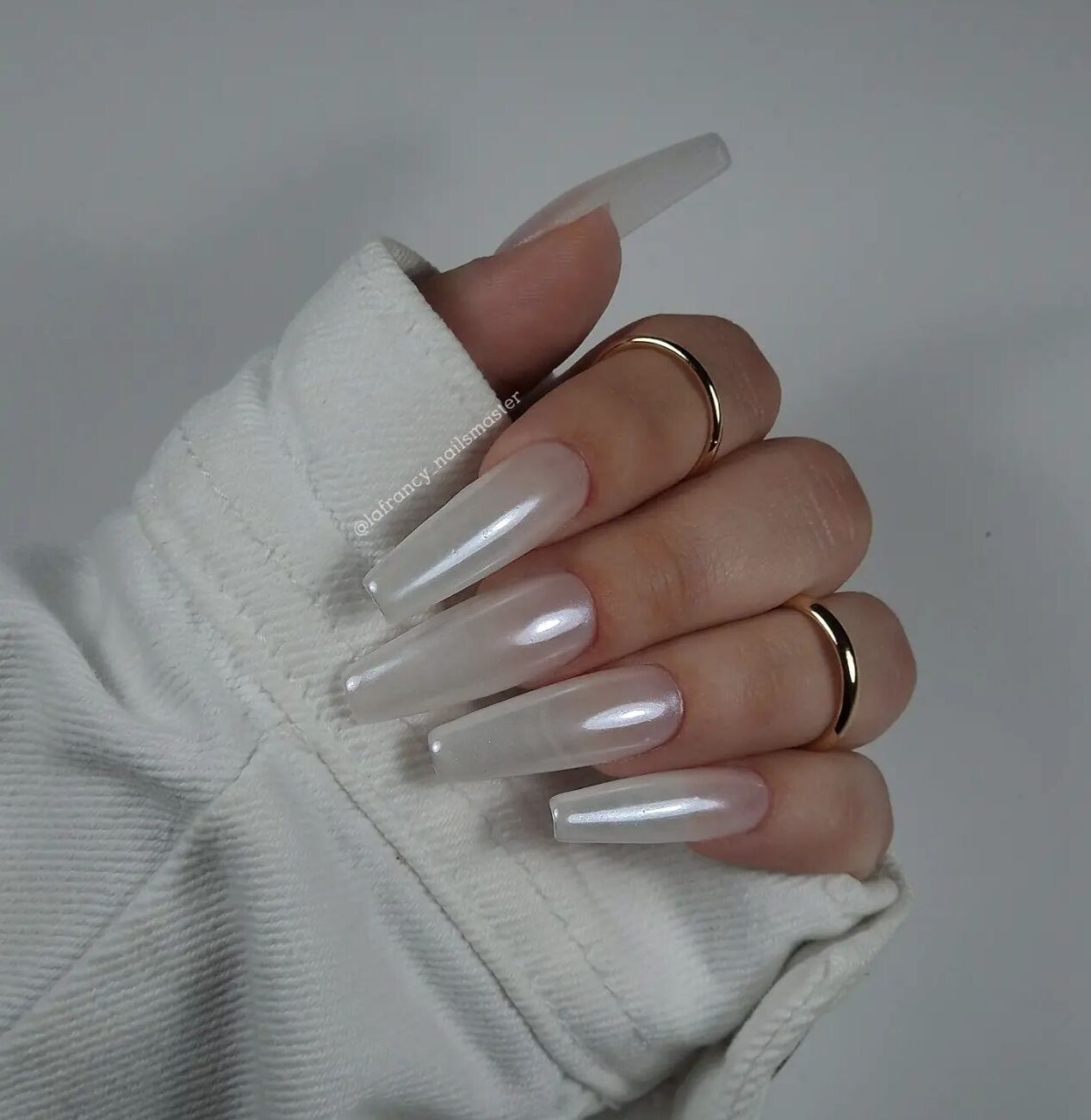 Pearl white nail polish in glossy finish on long tapered square nails